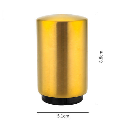 Gold cylindrical portable beer bottle opener with dimensions on a white background