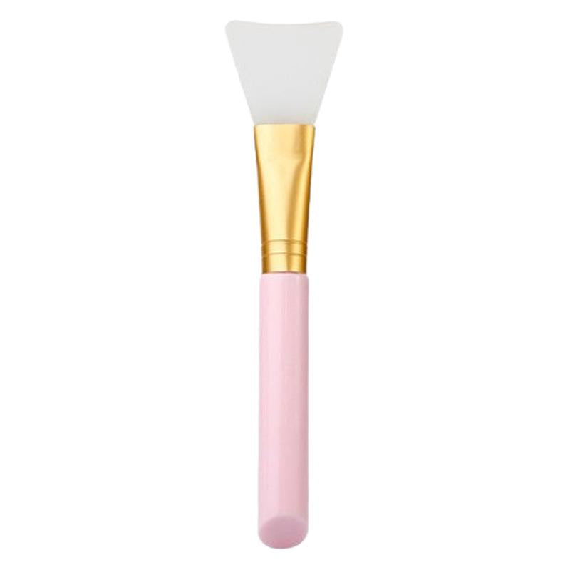 Facial Silicone Mask Brush with pink handle and gold ferrule on a white background
