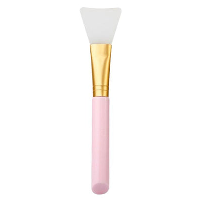 Facial Silicone Mask Brush with pink handle and gold ferrule on a white background
