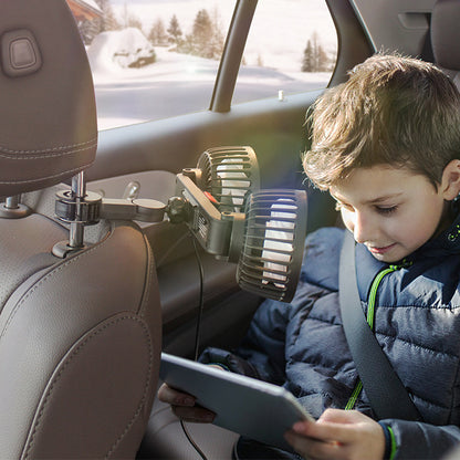 Child sitting in a car using a tablet with adjustable car backseat fan with a landscape outside