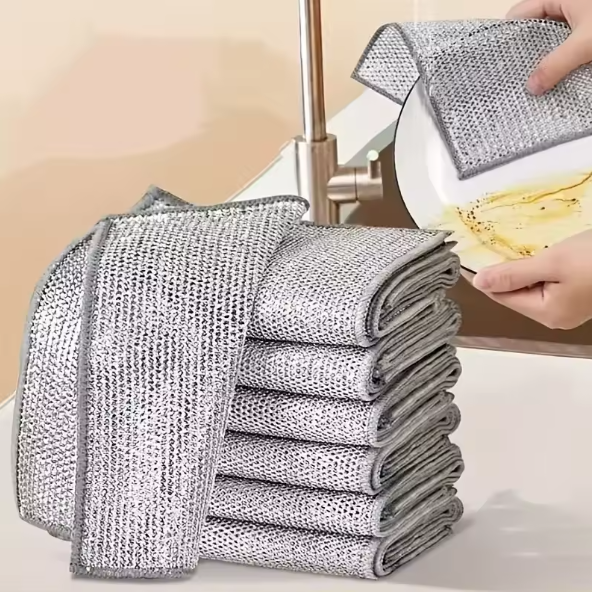 Stack of non-scratch wire dishcloth pads with a kitchen setting in the background