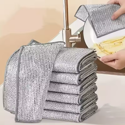Stack of non-scratch wire dishcloth pads with a kitchen setting in the background