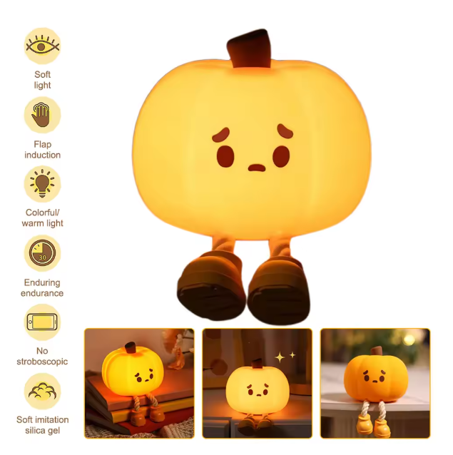 Pumpkin-shaped night light with features on a white background