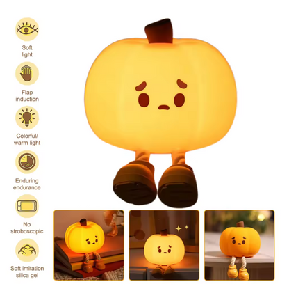 Pumpkin-shaped night light with features on a white background